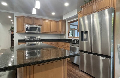 Racine House | Lake Michigan Retreat. Spacious 4-bedroom home on wooded lot across from lake.