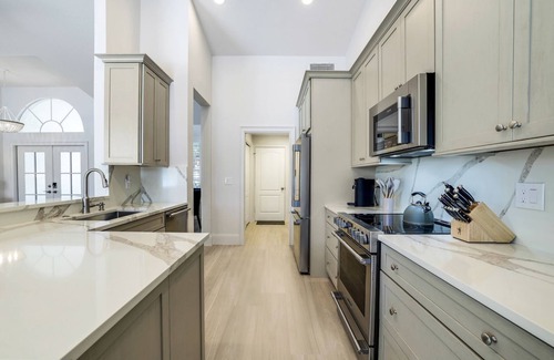Central Naples House | Lakefront 3-bedroom pool house in Briarwood. Morning sunrise!