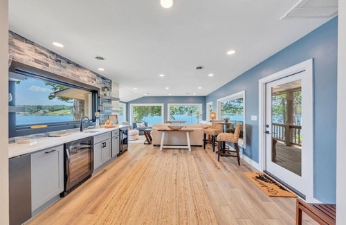 Moneta House | Lakefront 600 ft shore with beach & 28x28 ft deck, 4 King & 3 Twin beds for 11