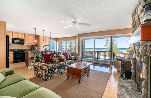 Glen Arbor Condo | Lakefront condo with deck, gorgeous view, fireplace, & W/D