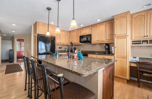 Glen Arbor Condo | Lakefront condo with deck, gorgeous view, fireplace, & W/D