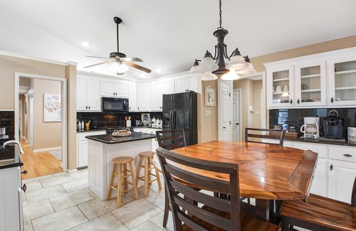 Mid America House | Lakefront dog-friendly home with lake views, dock, firepit, & grill area by lake