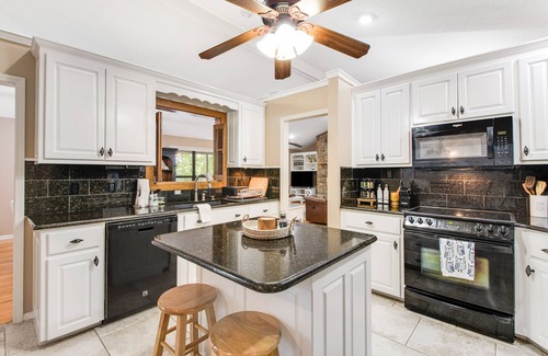 Mid America House | Lakefront dog-friendly home with lake views, dock, firepit, & grill area by lake