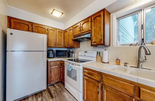 Dunes City House | Lakefront dream with private hot tub, dock, kayaks, pedal boat & amazing views