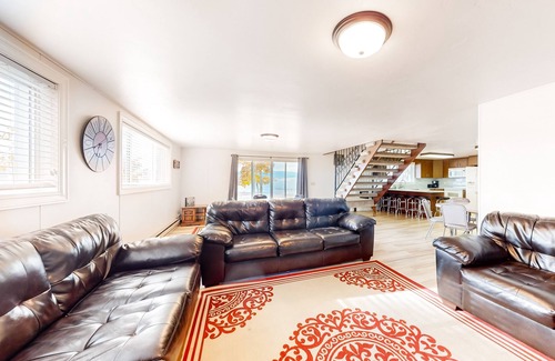 Laketown House | Lakefront east side home on private beach with mountain view & large grassy yard
