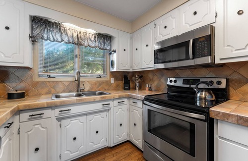 Mount Mourne House | Lakefront Home w/Dock, Game Room & Hot Tub | Ponderosa Peninsula by AvantStay