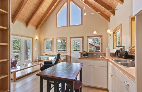 Sagle House | Lakefront home with tiki bar, private dock, hot tub, decks, fire pit, & kayaks