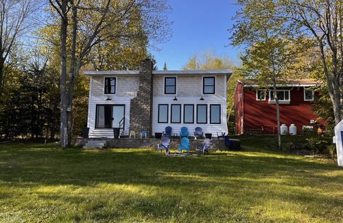 Raymond House | Lakefront Living. Kayak while bald eagles soar above and loons call out.