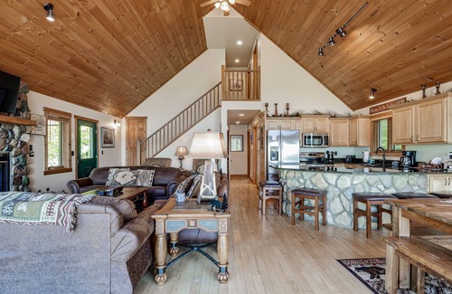 Eagle River House | Lakefront lodge with private dock, firepit, deck & sunset views