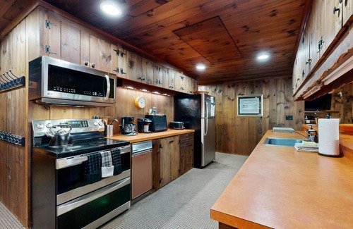 Wolfeboro House | Lakefront & ski retreat with wrap-around deck, wood fireplace, & private beach