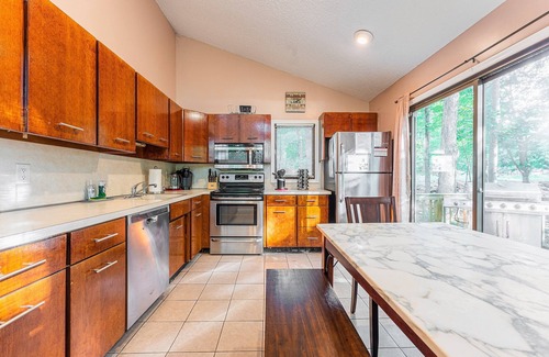 East Stroudsburg House | Lakefront with Kayaks, Canoe, Wood-Burning Fireplace, Pool, Hot Tub, and FirePit