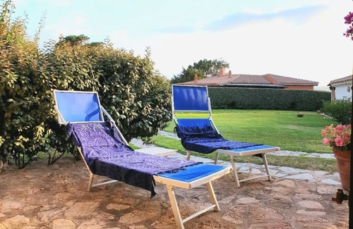 Baja Sardinia Apartment | Large and beautiful master bedroom with bathroom within walking distance of the sea.