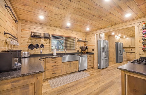 Island Park Cabin | Large Riverfront Cabin with Hot Tub, Arcade Games, & Luxury