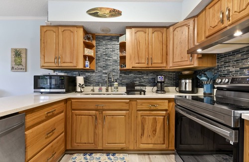 Fernandina Beach House | Latitude Adjustment-One block from the beach, shared pool, one dog allowed.