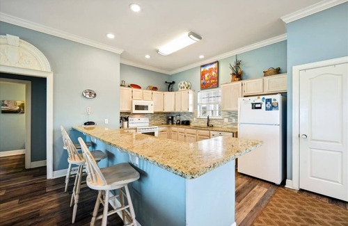Sea Palm Village House | LEAVE YOUR WORRIES SURFSIDE. Take the private boardwalk and you're only steps from the beach.