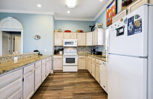 Sea Palm Village House | LEAVE YOUR WORRIES SURFSIDE. Take the private boardwalk and you're only steps from the beach.
