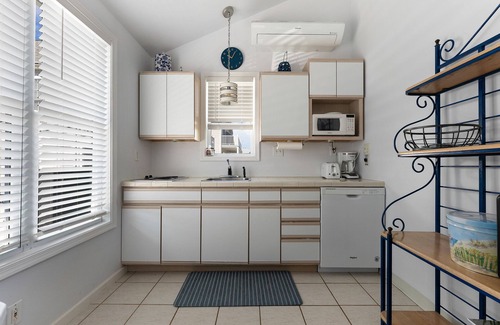 Townsend's Inlet Cottage | Light filled carriage house with gorgeous wrap around deck, ready for a perfect vacation getaway.