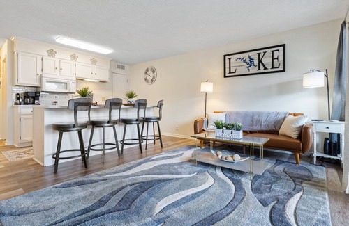 Village of Four Seasons Condo | Light filled condo with balcony, water views, grill & shared amenities