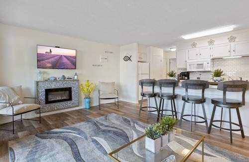 Village of Four Seasons Condo | Light filled condo with balcony, water views, grill & shared amenities