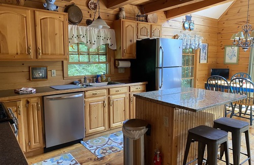 Kents Hill House | Light-Filled Log Home, 4 Wooded Acres, & Lake Access. The water is 0.4 mi away.