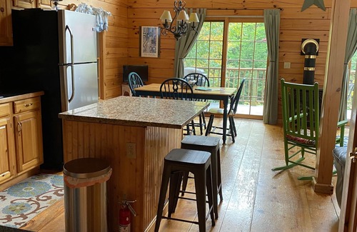 Kents Hill House | Light-Filled Log Home, 4 Wooded Acres, & Lake Access. The water is 0.4 mi away.
