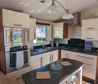 Weymouth Resort | Lovely and Bright Caravan Haven Littlesea with views across the Fleet Lagoon