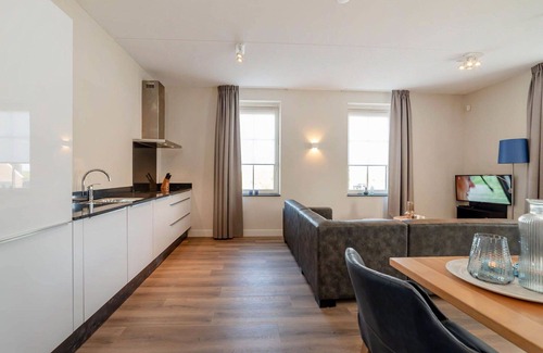 Colijnsplaat Apartment | Lovely apartment for 4 guests with hot tub, WIFI, TV and balcony