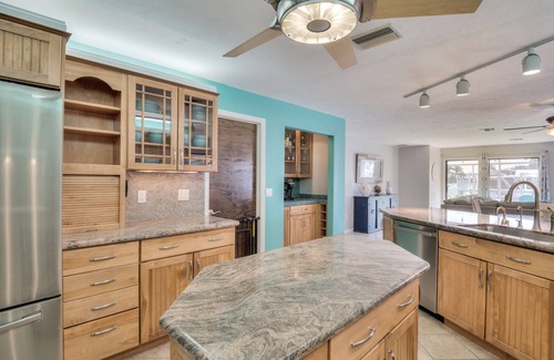 Yacht Club House | Lovely Canal Home in SW Cape with heated pool, game room, and a tiki on the dock