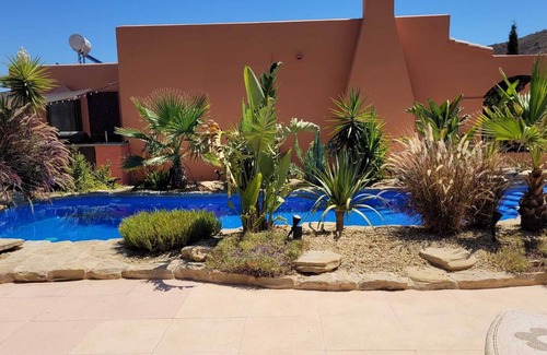 El Cortijo Grande Villa | Lovely villa with natural style swimming pool, fab outside area with great views