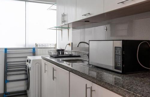 Armendariz Apartment | Lumiere 1BR by Geko