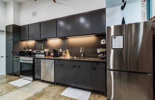 Downtown Apartment | Lux Downtown Flat with Gameroom & Fire Pit