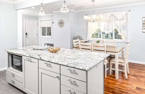 Tudor Area House | Luxe mountain-view escape - 2 condos w/4 fireplaces, deck, hot tub + dogs okay