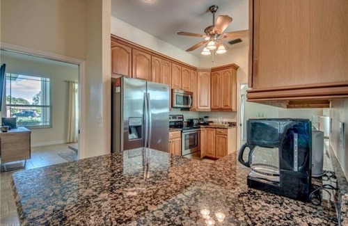 Caloosahatchee House | Luxurious 5 Star Gulf Access Canal home w boat lift, kayak lifts, pool, tiki hut