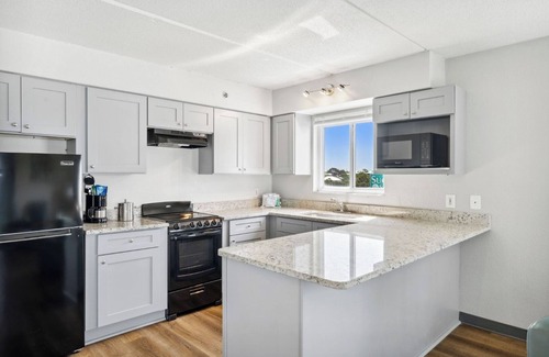 Fort Bay Hotel | Luxurious Beachfront Suite with Queen Beds, Kitchen, and Split Accommodations