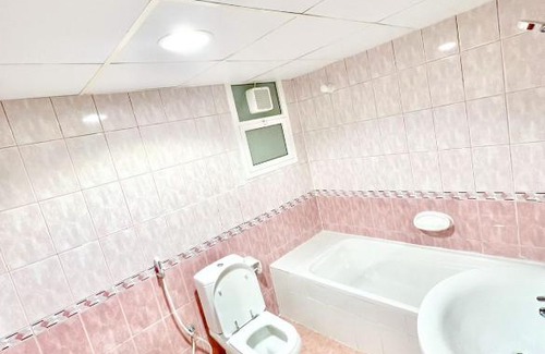 Al Majaz House | Luxury Awaits: Master Bedroom for Rent! Indulge in comfort and style.