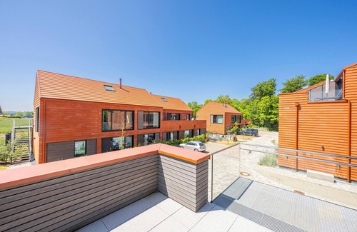 Hohwacht Apartment | Luxury loft apartment with rooftop terrace and fireplace.