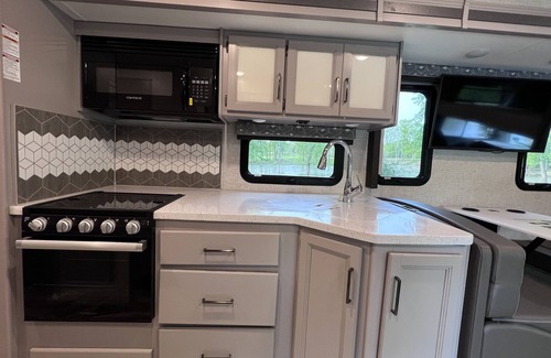 Walker House | Luxury RV with Bunkbeds Stationed on serene Grand River with private golf course