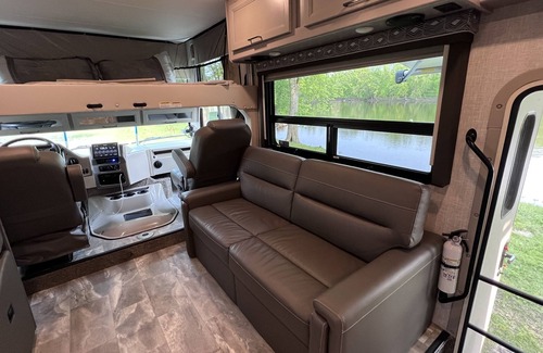 Walker House | Luxury RV with Bunkbeds Stationed on serene Grand River with private golf course