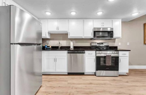 Downtown Branson Apartment | Luxury Waterfront Creekside, In/Out Pools & View!