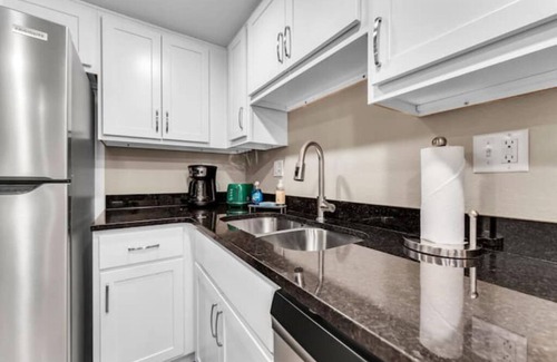 Downtown Branson Apartment | Luxury Waterfront Creekside, In/Out Pools & View!
