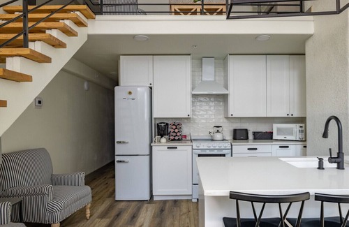 West Main Historic District Condo | Main Street Farmhouse. City Retreat by Hollyhock