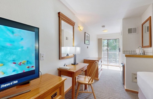 West End Cabin | Main Street studio - pool & hot tub - walk to lifts, dog-friendly, balcony