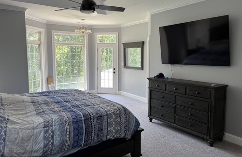 Fair Play House | Majestic Lakefront Home with private dock, basketball court, firepit, and more..