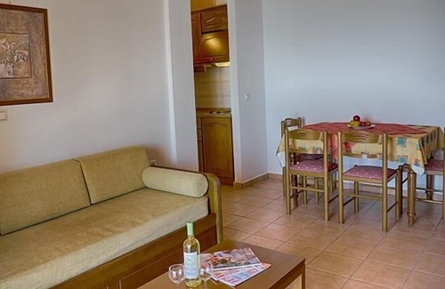 Agios Georgios Pagon Apartment | Maria's apartment 1 - right on the beach with sea views in the beautiful bay of Agios Georgios Pago