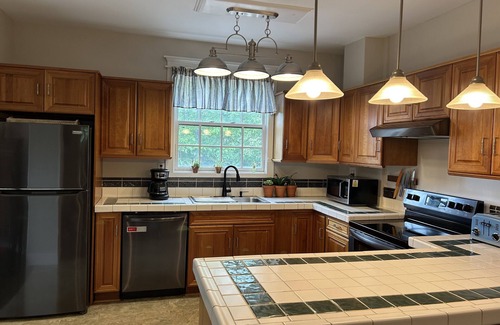 Lake Placid House | McKinley House: mountain views, fire pit, deck, walk to town & Mirror Lake