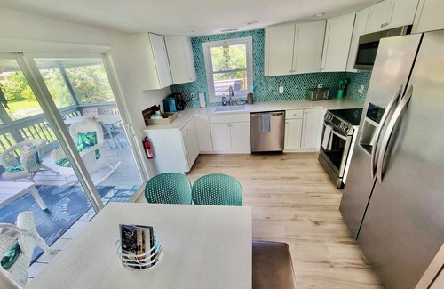 Chincoteague House | Mermaid & Mare, Downtown Retreat. Hot Tub, Firepit, fenced yard & Pet Friendly!