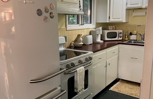 Willoughby Hills House | Mid Century Guest House on Wooded Lot