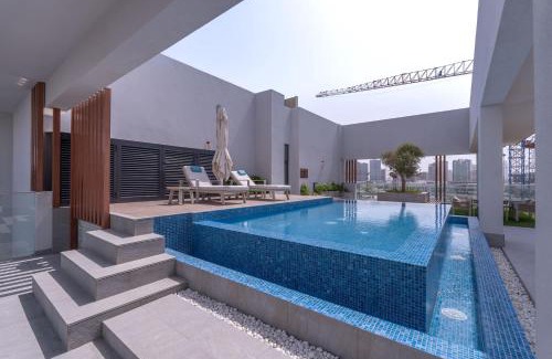 Jumeirah Village Circle Apartment | Minimalist Studio With Nature-Inspired Balcony in JVC