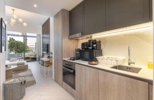 Jumeirah Village Circle Apartment | Minimalist Studio With Nature-Inspired Balcony in JVC