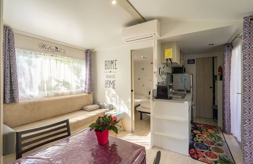 Les Mathes RV Rental | Mobile Home 'Mobil Home La Palmyre 4etoiles' with Private Terrace, Garden and Air Conditioning